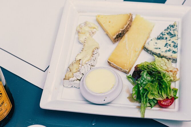A Morning in Paris Food Tour: Croissants, Baguettes & Chocolate - Cheese, salted butter, and fruit jelly
