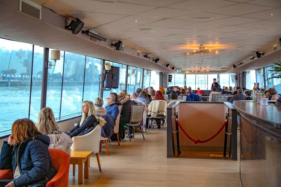 Bordeaux: Guided Wine and Canelé Discovery Cruise - Indoor comfort, outdoor views, and weather