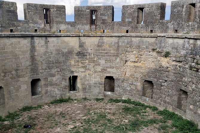 Carcassonne 's Medieval Walls: A Self-Guided Tour - Château Comtal where castle meets wall