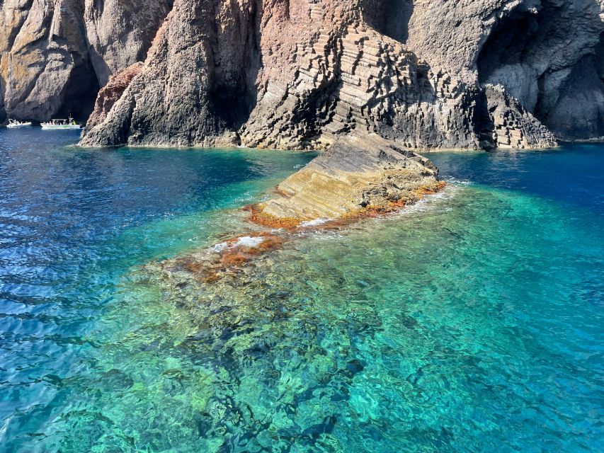 From Cargèse: Scandola Day Tour & Girolata Lunch Stop - Red rock, caves, and clear water at Capo Rosso