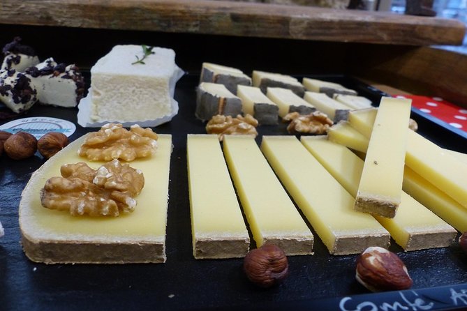Lyon Old Town Food Tour with Local Specialties Tasting & Lunch - Charcuterie, red wine, and the Lyonnaise table