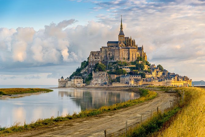 Mont Saint Michel Guided Day Trip with Abbey Entry from Paris - Climbing the fortifications through the medieval village