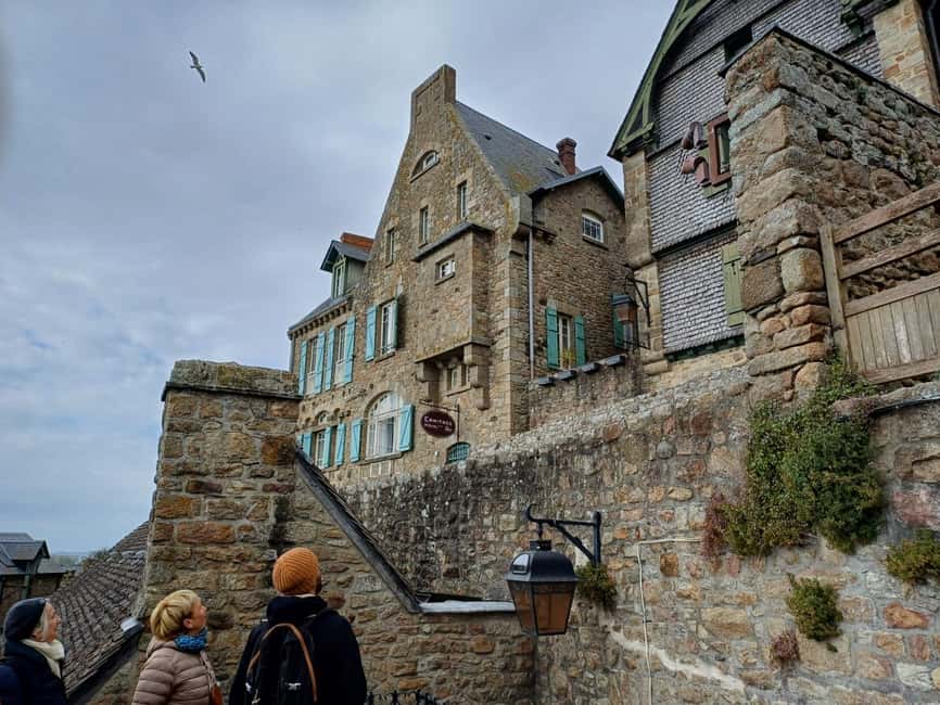 Mont Saint Michel: Village History and Legends Walking Tour - Meeting at the shuttle and crossing toward the Mont