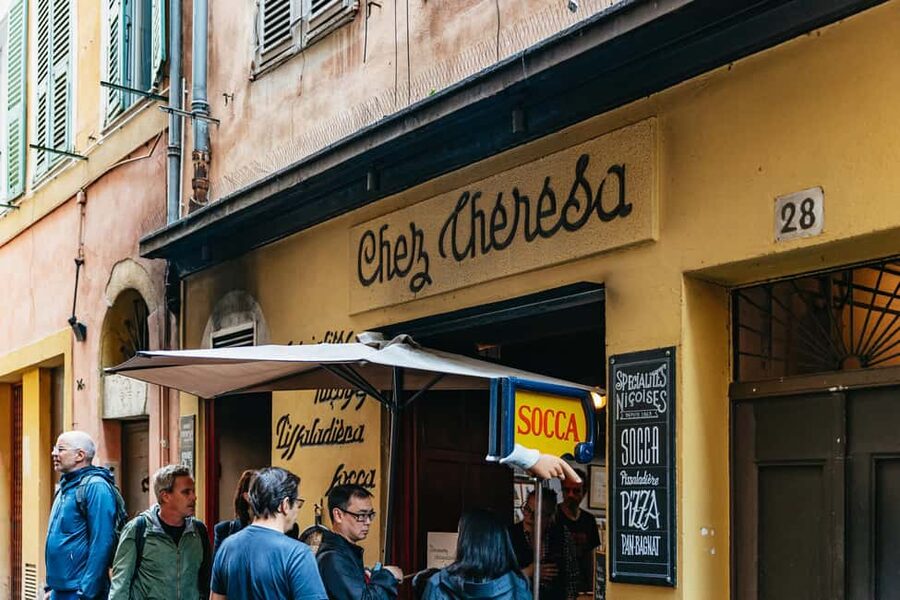 Nice: Sunset Food Tour with Full Meal and Wine - Pissaladière brings onions, olives, and anchovies