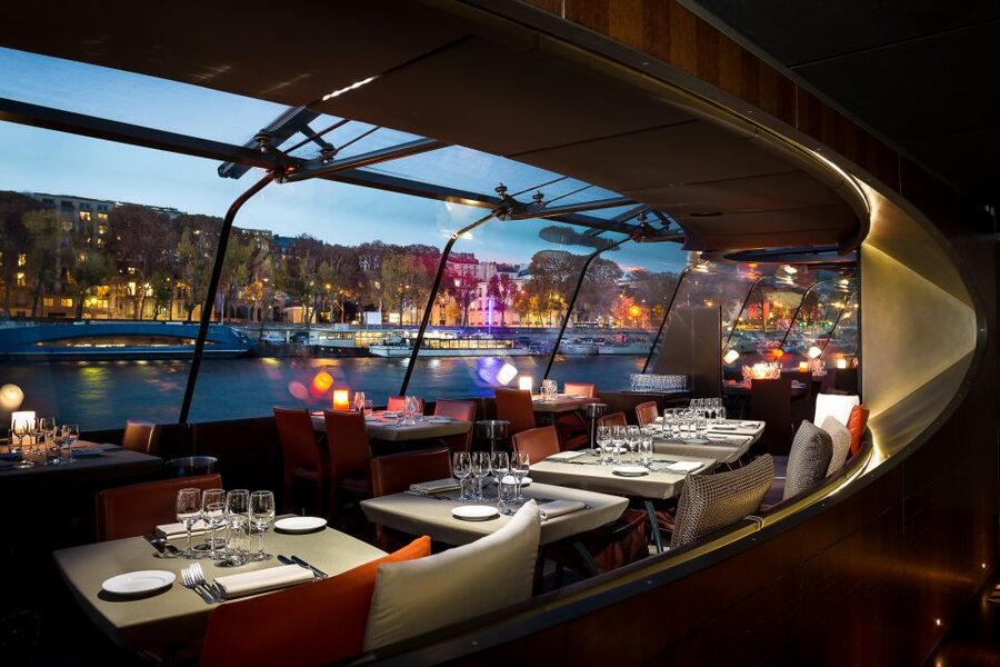 Paris: 3-Course-Dinner Cruise with Wine on the Seine River - Dinner arrives while Paris changes color