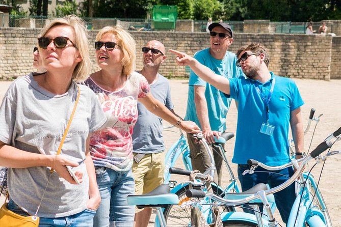 Paris Bike Tour Hidden Secrets in the Latin Quarter & Le Marais neighborhoods - Place des Vosges, royal design with local life