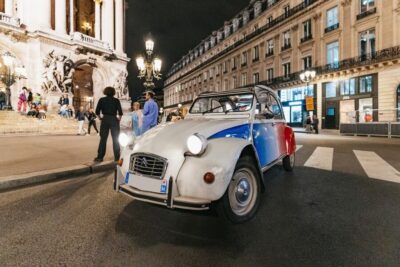 Discover Paris by Night in a Vintage Car with a Local