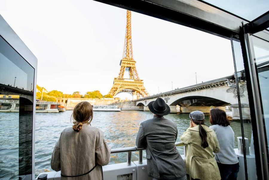 Paris: Eiffel Tower Tour & Seine River Cruise Tour - Riding up to the Eiffel Tower’s second floor