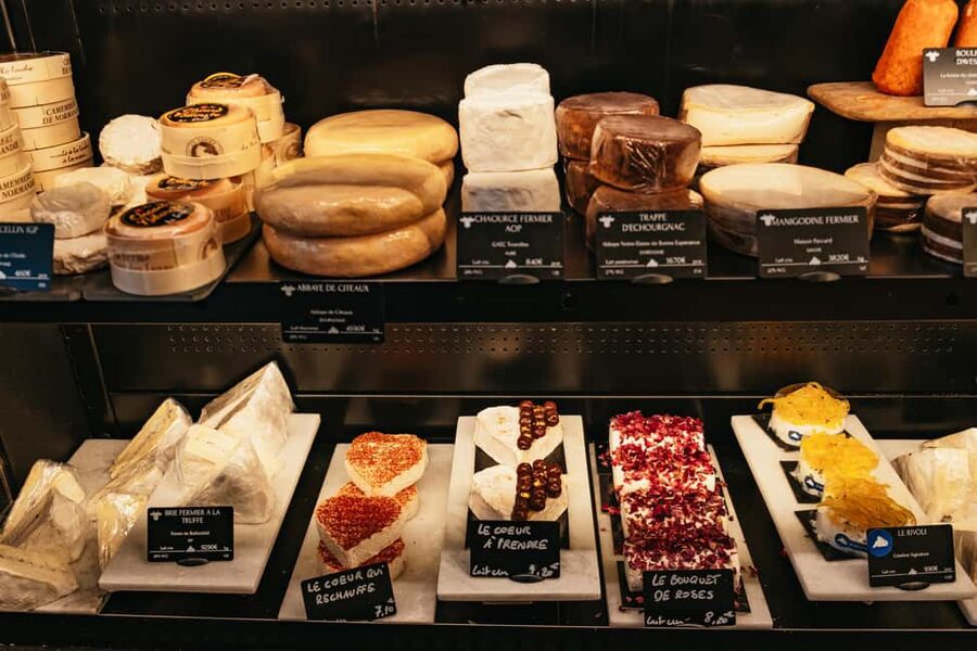 Paris: Gourmet Food Tour with Over 10 Tastings and Wine - Market streets, historic shops, and a sweet finish