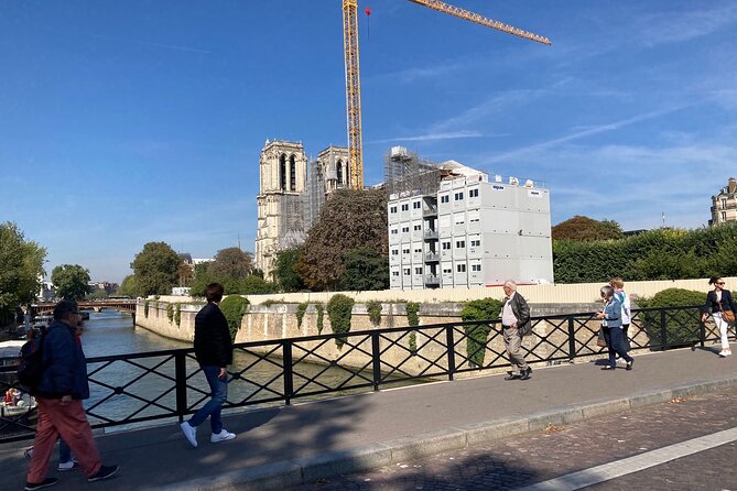 Paris: Île de la Cité and Notre-Dame Walking Tour With Crypt - The flower market changes the mood