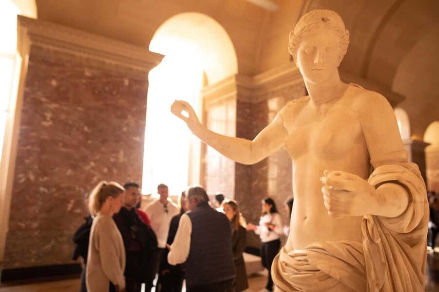 Paris Louvre Exclusive Semi Private Guided Tour Max 6 People - The Louvre Pyramid and the first sense of scale