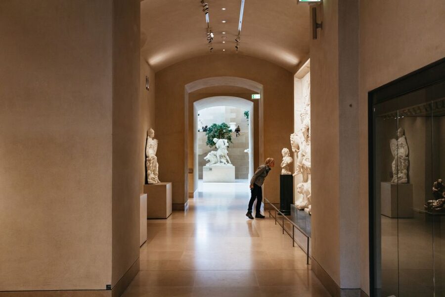 Paris: Louvre Museum Entry Ticket With Host and River Cruise - Entering the Louvre with a timed reservation