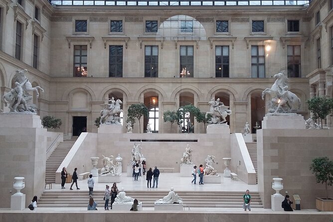 Paris: Louvre Museum Tour Mona Lisa & Iconic Masterpieces - Meeting the guide at Kiosque des Noctambules