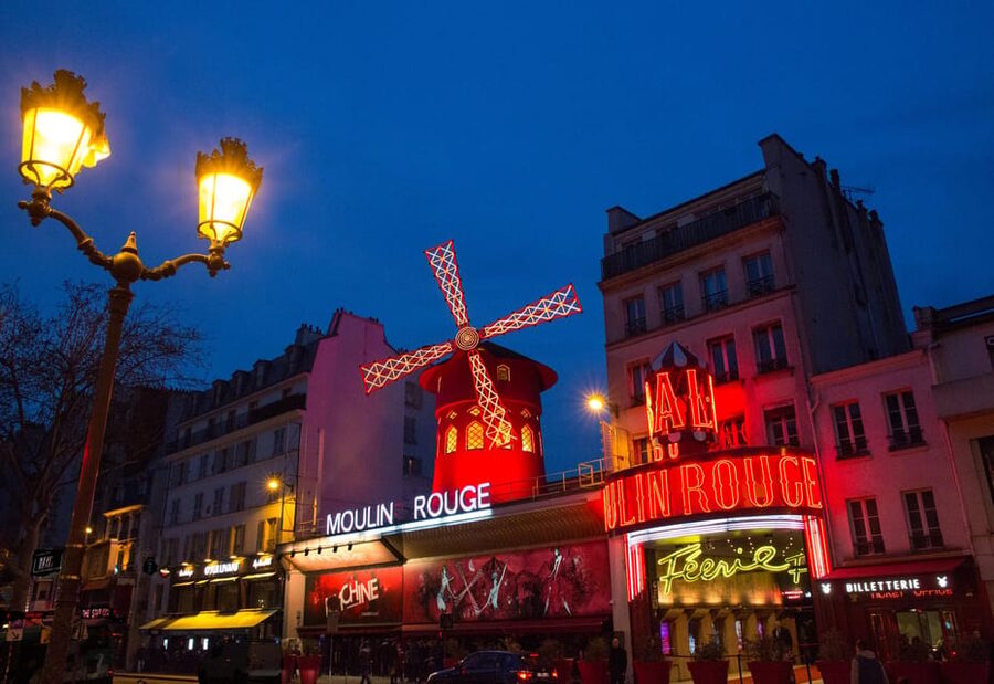 Paris: Moulin Rouge Show with Champagne and Drop-Off Service - Entering the Moulin Rouge in Montmartre