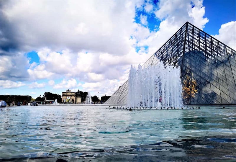 Paris: private city tour with seine river cruise - Saint-Germain-lAuxerrois and the Cour Carrée