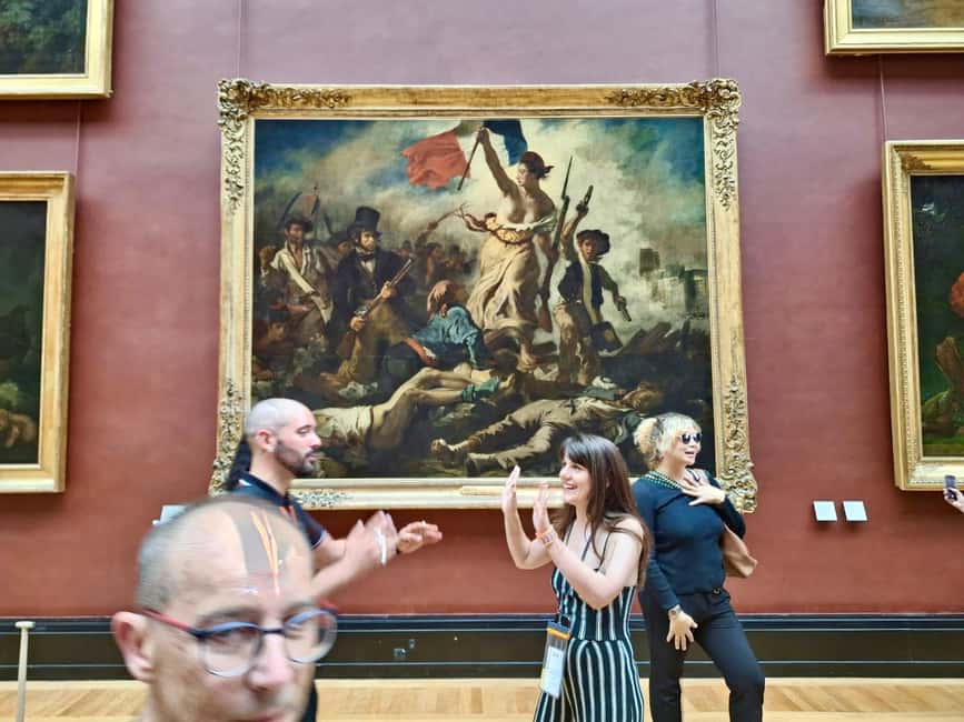 Skip-the-Line Louvre Museum Tour with Artist - Crossing the Louvre Pyramid and entering the museum