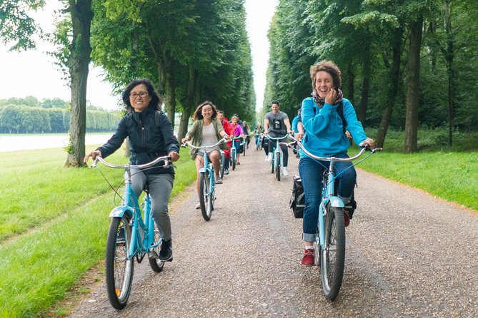 Versailles Palace Bike Tour with Market & Marie-Antoinette hamlet - Riding through the formal Versailles gardens